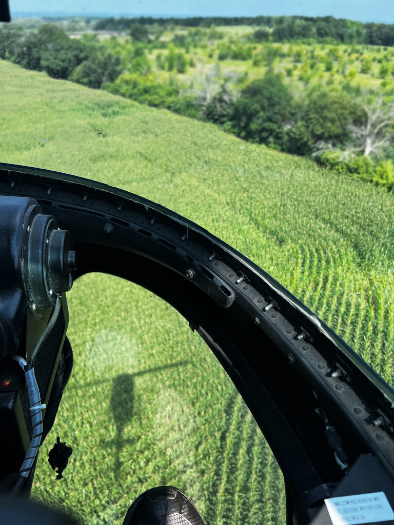 View of a corn field crop from up in a helicopter